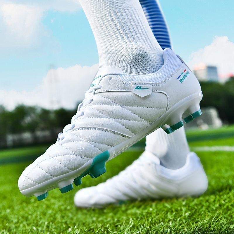 Custom NIA football boot on the pitch