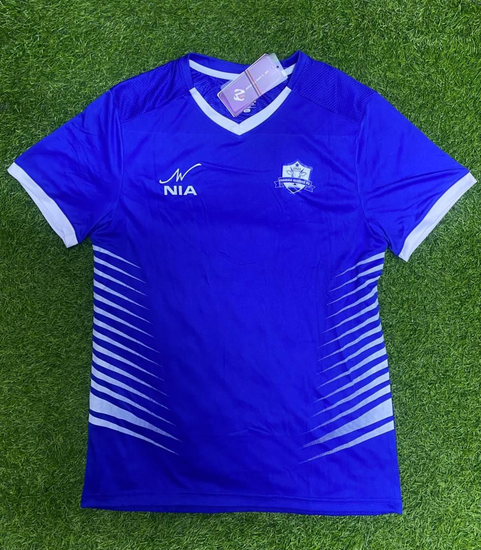 Custom NIA jersey laid flat on turf
